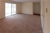 one bedroom apt. living room, view standing in kitchen