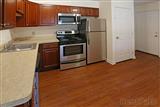 two bedroom apt. kitchen, dark cabinets, stainless appliances