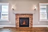 Fireplace-flat against wall with stone
