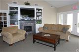 clubhouse community room with seating and cable television