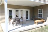 clubhouse patio with seating and grill